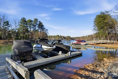Set on a private golf course lot overlooking the 6th hole, this on Trump National Golf Club Charlotte in North Carolina - for sale on GolfHomes.com, golf home, golf lot