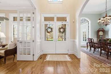 Set on a private golf course lot overlooking the 6th hole, this on Trump National Golf Club Charlotte in North Carolina - for sale on GolfHomes.com, golf home, golf lot