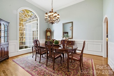 Set on a private golf course lot overlooking the 6th hole, this on Trump National Golf Club Charlotte in North Carolina - for sale on GolfHomes.com, golf home, golf lot