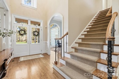 Set on a private golf course lot overlooking the 6th hole, this on Trump National Golf Club Charlotte in North Carolina - for sale on GolfHomes.com, golf home, golf lot