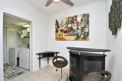 This Portofino condo provides a great open living space with on Barefoot Resort and Golf Club  in South Carolina - for sale on GolfHomes.com, golf home, golf lot
