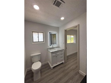 Welcome to your dream retreat in beautiful Lake Estates, FL! on Indian Lake Estates Golf and Country Club in Florida - for sale on GolfHomes.com, golf home, golf lot