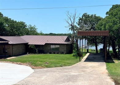 Walk out the back door and straight into Lake Nocona! You could on Nocona Hills Golf Course in Texas - for sale on GolfHomes.com, golf home, golf lot