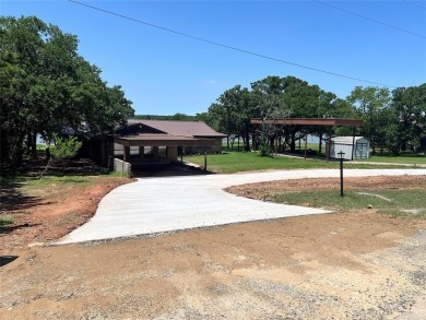 Walk out the back door and straight into Lake Nocona! You could on Nocona Hills Golf Course in Texas - for sale on GolfHomes.com, golf home, golf lot