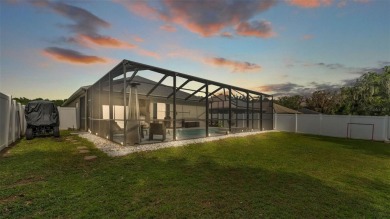 Welcome to 4565 Fairway Oaks Drive - a stunning 4-bedroom on Imperial Lakes Country Club in Florida - for sale on GolfHomes.com, golf home, golf lot