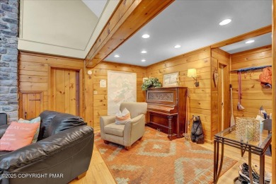 Rustic mountain escape with warm wood features! This 3 bedroom on Split Rock Resort and Country Club in Pennsylvania - for sale on GolfHomes.com, golf home, golf lot