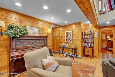 Rustic mountain escape with warm wood features! This 3 bedroom on Split Rock Resort and Country Club in Pennsylvania - for sale on GolfHomes.com, golf home, golf lot