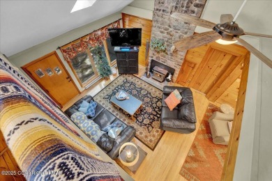 Rustic mountain escape with warm wood features! This 3 bedroom on Split Rock Resort and Country Club in Pennsylvania - for sale on GolfHomes.com, golf home, golf lot