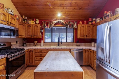 Looking for the perfect escape in nature? This fully furnished on Pinetop Lakes Golf and Country Club in Arizona - for sale on GolfHomes.com, golf home, golf lot