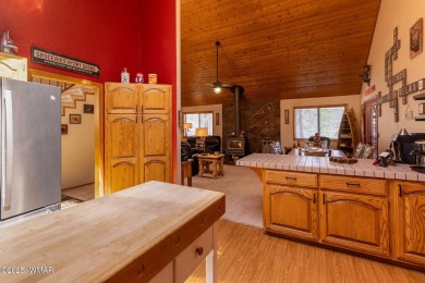 Looking for the perfect escape in nature? This fully furnished on Pinetop Lakes Golf and Country Club in Arizona - for sale on GolfHomes.com, golf home, golf lot