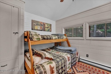Rustic mountain escape with warm wood features! This 3 bedroom on Split Rock Resort and Country Club in Pennsylvania - for sale on GolfHomes.com, golf home, golf lot
