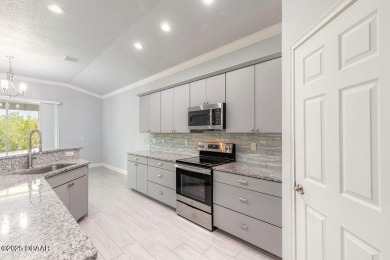 Welcome to this pristine and nearly new residence nestled in the on LPGA International Golf Course in Florida - for sale on GolfHomes.com, golf home, golf lot