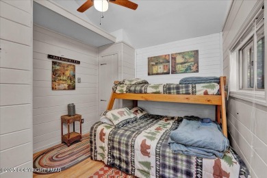 Rustic mountain escape with warm wood features! This 3 bedroom on Split Rock Resort and Country Club in Pennsylvania - for sale on GolfHomes.com, golf home, golf lot