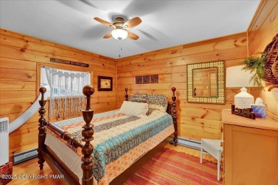 Rustic mountain escape with warm wood features! This 3 bedroom on Split Rock Resort and Country Club in Pennsylvania - for sale on GolfHomes.com, golf home, golf lot
