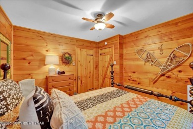 Rustic mountain escape with warm wood features! This 3 bedroom on Split Rock Resort and Country Club in Pennsylvania - for sale on GolfHomes.com, golf home, golf lot