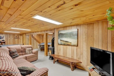 Rustic mountain escape with warm wood features! This 3 bedroom on Split Rock Resort and Country Club in Pennsylvania - for sale on GolfHomes.com, golf home, golf lot