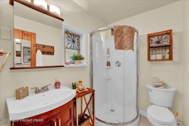 Rustic mountain escape with warm wood features! This 3 bedroom on Split Rock Resort and Country Club in Pennsylvania - for sale on GolfHomes.com, golf home, golf lot