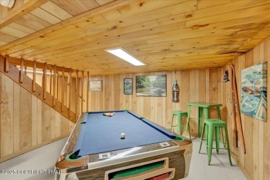 Rustic mountain escape with warm wood features! This 3 bedroom on Split Rock Resort and Country Club in Pennsylvania - for sale on GolfHomes.com, golf home, golf lot