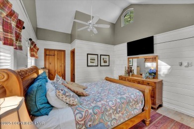 Rustic mountain escape with warm wood features! This 3 bedroom on Split Rock Resort and Country Club in Pennsylvania - for sale on GolfHomes.com, golf home, golf lot