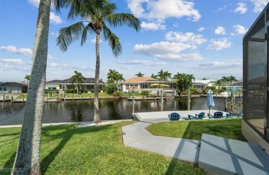Welcome to your luxury waterfront oasis in Southwest Cape Coral on Royal Tee Country Club in Florida - for sale on GolfHomes.com, golf home, golf lot