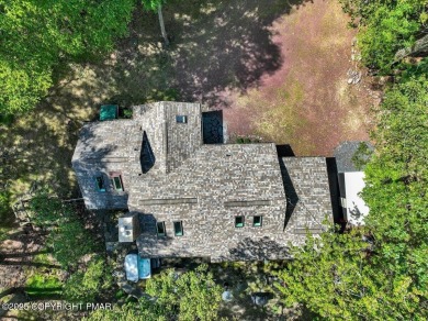 Rustic mountain escape with warm wood features! This 3 bedroom on Split Rock Resort and Country Club in Pennsylvania - for sale on GolfHomes.com, golf home, golf lot