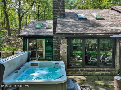 Rustic mountain escape with warm wood features! This 3 bedroom on Split Rock Resort and Country Club in Pennsylvania - for sale on GolfHomes.com, golf home, golf lot