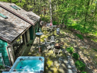 Rustic mountain escape with warm wood features! This 3 bedroom on Split Rock Resort and Country Club in Pennsylvania - for sale on GolfHomes.com, golf home, golf lot