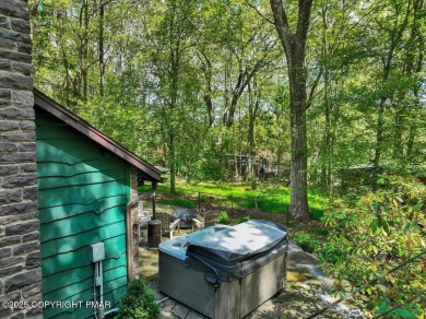 Rustic mountain escape with warm wood features! This 3 bedroom on Split Rock Resort and Country Club in Pennsylvania - for sale on GolfHomes.com, golf home, golf lot