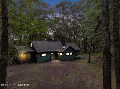 Rustic mountain escape with warm wood features! This 3 bedroom on Split Rock Resort and Country Club in Pennsylvania - for sale on GolfHomes.com, golf home, golf lot