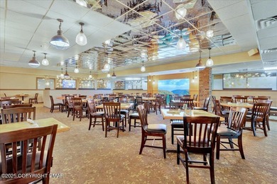 Rustic mountain escape with warm wood features! This 3 bedroom on Split Rock Resort and Country Club in Pennsylvania - for sale on GolfHomes.com, golf home, golf lot