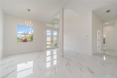 Welcome to effortless luxury in the coveted Royal Palm Golf on Eagle Lakes Golf Club in Florida - for sale on GolfHomes.com, golf home, golf lot