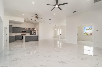 Welcome to effortless luxury in the coveted Royal Palm Golf on Eagle Lakes Golf Club in Florida - for sale on GolfHomes.com, golf home, golf lot