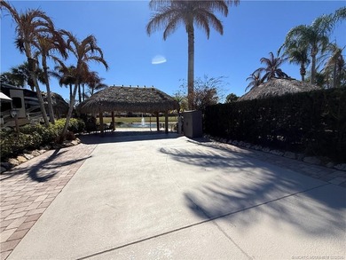 Nestled within an exclusive gated RV resort, this exceptional on St. Lucie Trail Golf Club in Florida - for sale on GolfHomes.com, golf home, golf lot