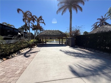 Nestled within an exclusive gated RV resort, this exceptional on St. Lucie Trail Golf Club in Florida - for sale on GolfHomes.com, golf home, golf lot