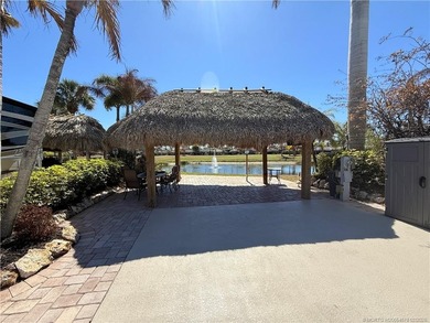 Nestled within an exclusive gated RV resort, this exceptional on St. Lucie Trail Golf Club in Florida - for sale on GolfHomes.com, golf home, golf lot