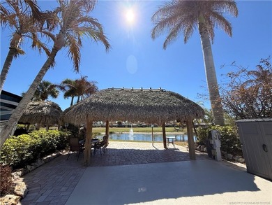 Nestled within an exclusive gated RV resort, this exceptional on St. Lucie Trail Golf Club in Florida - for sale on GolfHomes.com, golf home, golf lot