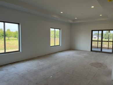 Located just a short golf cart ride from Denali's on the River on River Ridge Golf Club in Iowa - for sale on GolfHomes.com, golf home, golf lot