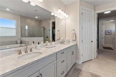 DESIGNER HOME WITH LAKE VIEW, OVERSIZED THREE CAR GARAGE & on Bonita National Golf Course in Florida - for sale on GolfHomes.com, golf home, golf lot