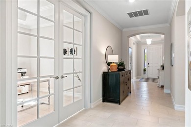 DESIGNER HOME WITH LAKE VIEW, OVERSIZED THREE CAR GARAGE & on Bonita National Golf Course in Florida - for sale on GolfHomes.com, golf home, golf lot