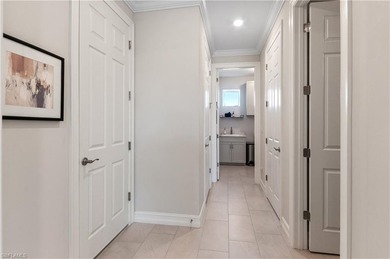 DESIGNER HOME WITH LAKE VIEW, OVERSIZED THREE CAR GARAGE & on Bonita National Golf Course in Florida - for sale on GolfHomes.com, golf home, golf lot