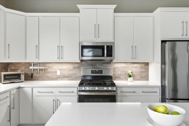 Enjoy refined living in this exquisitely crafted townhome in the on Kwiniaska Golf Club in Vermont - for sale on GolfHomes.com, golf home, golf lot