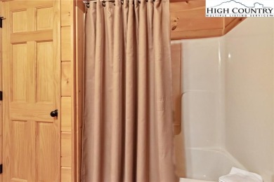 This beautifully maintained and furnished Blue Ridge Log Cabin on Beech Mountain Club in North Carolina - for sale on GolfHomes.com, golf home, golf lot