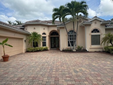 Step into the covered entry and elegant foyer, a formal dining on Estero Country Club in Florida - for sale on GolfHomes.com, golf home, golf lot