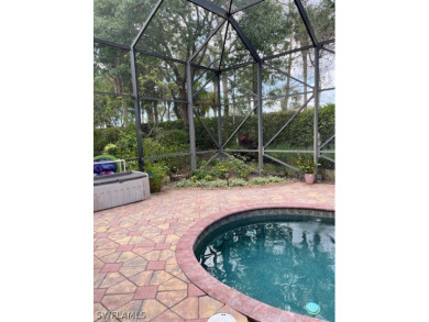 Step into the covered entry and elegant foyer, a formal dining on Estero Country Club in Florida - for sale on GolfHomes.com, golf home, golf lot