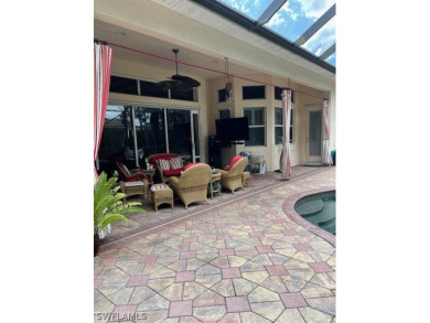 Step into the covered entry and elegant foyer, a formal dining on Estero Country Club in Florida - for sale on GolfHomes.com, golf home, golf lot