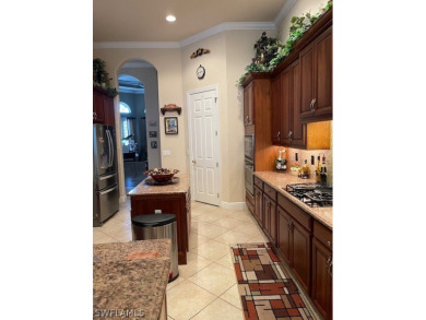 Step into the covered entry and elegant foyer, a formal dining on Estero Country Club in Florida - for sale on GolfHomes.com, golf home, golf lot