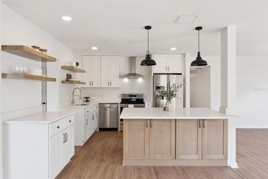 One or more photo(s) has been virtually stagedpletely remodeled on Country Club of Orlando in Florida - for sale on GolfHomes.com, golf home, golf lot