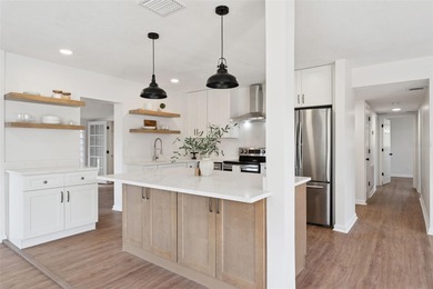 One or more photo(s) has been virtually stagedpletely remodeled on Country Club of Orlando in Florida - for sale on GolfHomes.com, golf home, golf lot