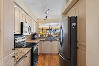 This light and bright 2nd floor condo in Bahia Vista has on Isla Del Sol Yacht and Country Club in Florida - for sale on GolfHomes.com, golf home, golf lot