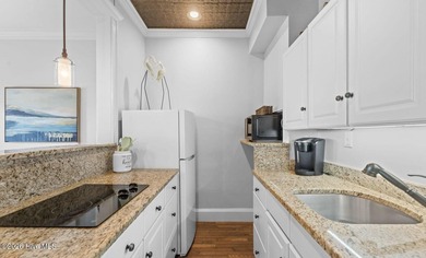 The Cape Fear Suite offers front-row views of the Bald Head on Bald Head Island Golf Club in North Carolina - for sale on GolfHomes.com, golf home, golf lot